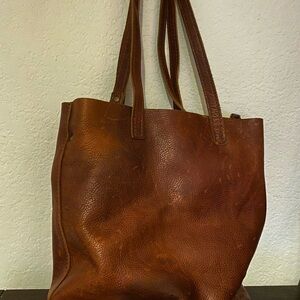 Medium crossbody leather tote. A few scuffs see pictures.